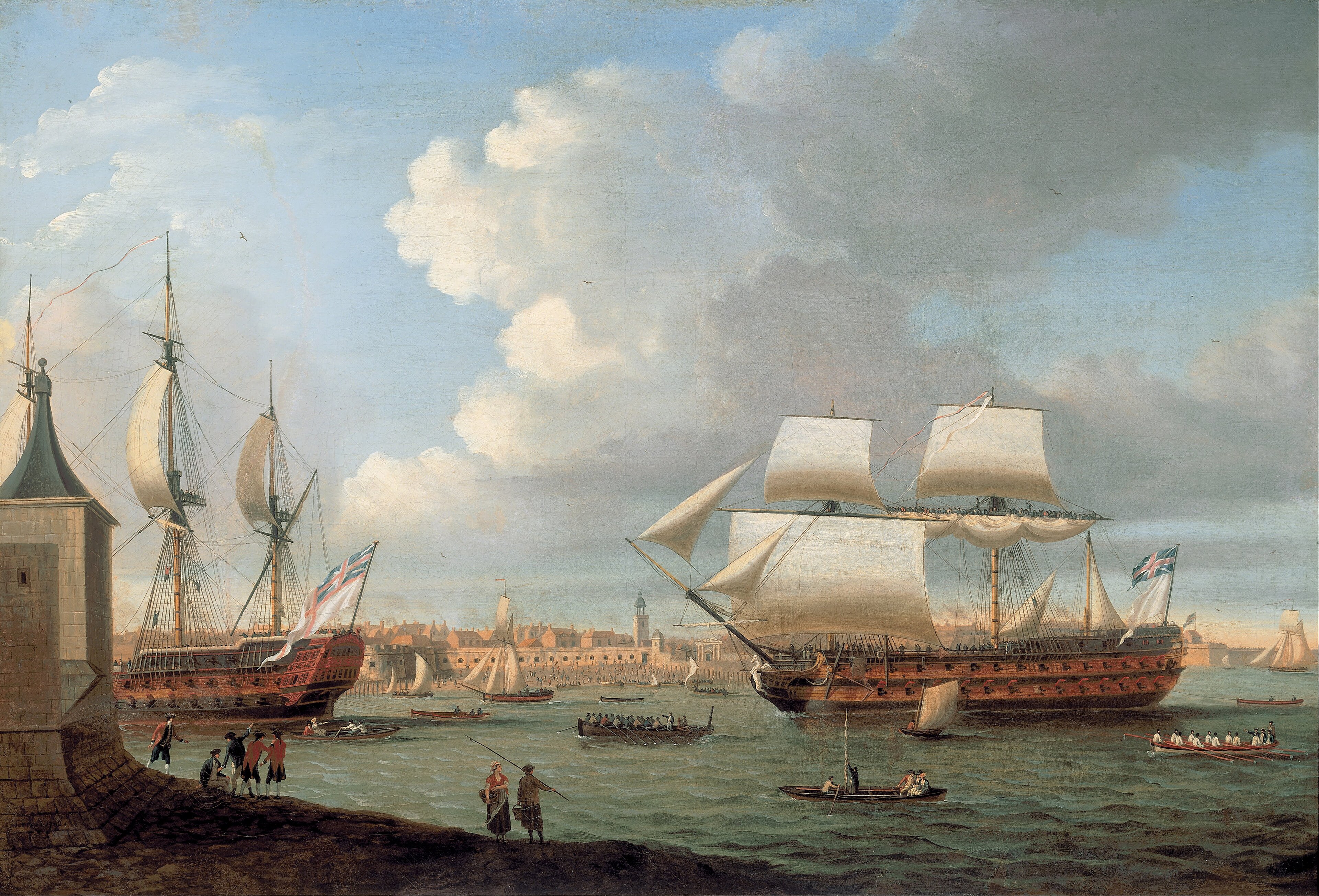 A British harbour scene with two warships at anchor and small craft in the foreground, late 18th / early 19th century